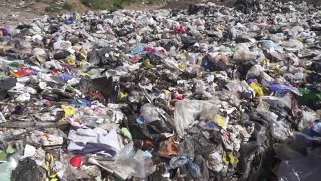 Slow-motion-pan-over-waste-in-a-dumping-ground