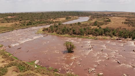 Aerial-drone-shot-of-Africa-Landscape-of-Masai-Mara-Beautiful-River-Landscape-Scenery-in-Maasai-Mara-National-Reserve-in-Kenya,-Africa,-Orbitting-Establishing-Shot