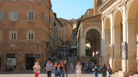 People-At-The-Historical-Sites-In-The-Public-Square-Of-Urbino-Old-Town-In-Italy