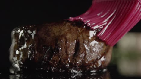 A-cooked-steak-is-basted-with-butter