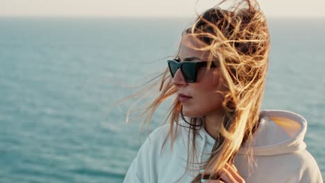 Beautiful-Profile-Shot-Of-Lady-Wearing-Sunglasses-,-Her-Hair-Flying-In-Strong-Wind