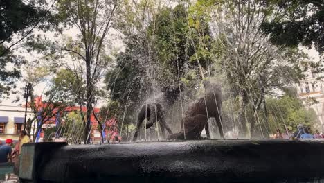Slow-motion-coyotes-fountain-in-Coyoacan,-Mexico-City