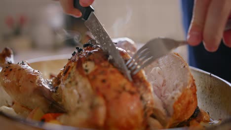 A-person-carves-cooked-poultry