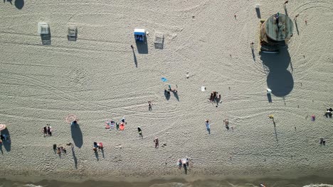 aerial-top-down-Miami-south-beach-florida-waves-on-white-tropical-Bech-and-life-guard-tower