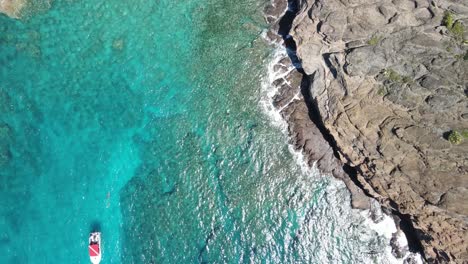 Amazing-rising-shot-of-Coin-de-Mire-inner-bay's-turquoise-blue-water