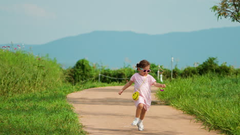 Little-Toddler-Girl-Running-in-Scenic-Highlands-Park-in-Slow-Motion