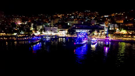 Beautiful-Bay-of-Saranda-at-Night-Illuminated-by-Promenade-Lights,-with-Anchored-Tour-Ships-Creating-a-Magical-Summer-Vacation-Scene