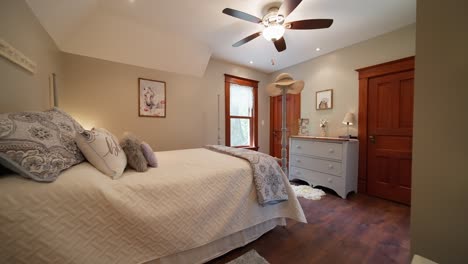 wide-push-in-shot-of-a-teenagers-bedroom-decorated-with-white-and-bright-accents
