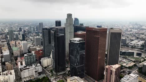 Aerial-view-of-downtown-of-Los-Angeles,-cloudy-CA,-USA---pull-back,-drone-shot