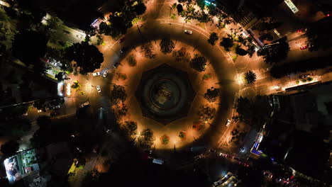Aerial-view-descending-above-the-Fuente-de-Cibeles-Plaza,-night-in-Mexico-city