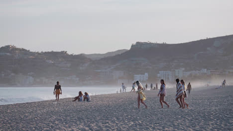 Group-Of-Female-Tourists-Walking-At-The-Beach-In-Baja-California-Sur,-Mexico