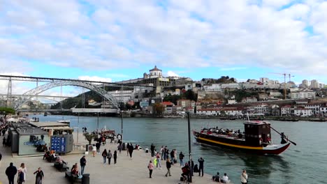 Rabelo-traditional-boat-navigating-Douro-River-in-Porto,-Portugal