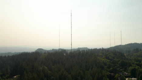 Circling-aerial-shot-of-Forest-park-hill-antennae-for-Portland-Oregon