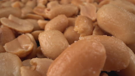 Toasted-salted-peanuts-macro,-food-product-used-in-many-commercial-producers-and-recipes-like-chocolates,-sauces-and-oils,-known-allergen,-healthy-nuts,-peanut-allergy,-4K-shot