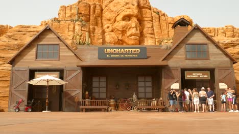 Tourists-At-The-Entrance-Of-Uncharted-The-Enigma-of-Penitence-In-PortAventura-World-Amusement-Park-In-Salou,-Spain