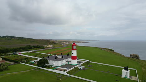 Aerial-drone-shot-of-Souter-Lighthouse-and-sea-coastline-Sunderland-North-East-England