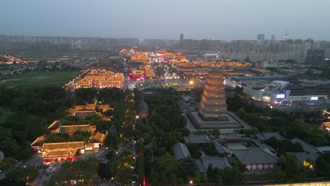 Aerial-over-Giant-Wild-Goose-Pagoda,-an-iconic-historical-landmark-situated-in-the-city-of-Xi'an,-Shaanxi-Province,-China