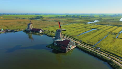 Dutch-windmills-next-to-Zaan-river-at-Zaanse-Schans-polder-summer-drone