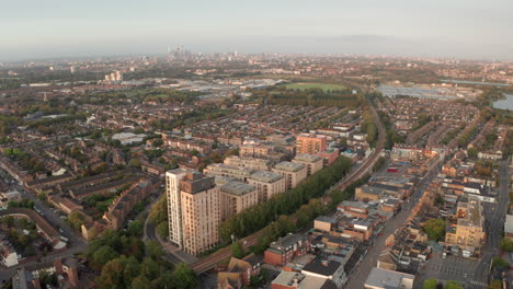 Aerial-shot-over-Walthamstow-looking-towards-central-London-at-golden-hour