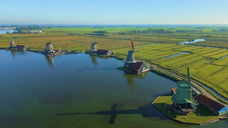 Famous-Zaanse-Schans-row-Dutch-windmills-next-to-Zaan-river-in-Zaanstad