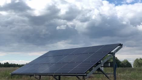 Timelapse-of-solar-panel-isolated-installed-in-countryside-field-sunny-bright-clouds-forecast-weather-condition-efficiency-of-photovoltaic-renewable-energy-production