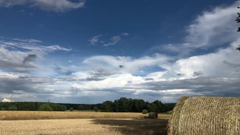 time-lapse-of-Hay-bales-in-green-natural-organic-agricultural-field-farm-harvesting-season