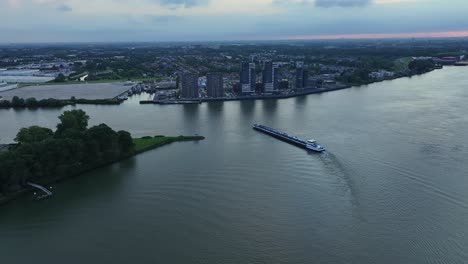Cargo-Barge-travelling-along-a-Dutch-waterway