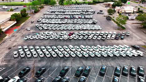 Flying-slowly-over-a-huge-parking-lot-full-of-undercover-unmarked-police-cars