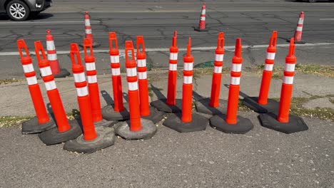 Group-of-safety-cones-on-the-side-of-an-asphalt-road