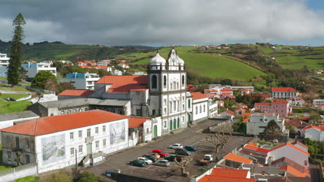 Aerial-drone-shot-of-old-church-of-Horta-town-in-Faial-island,-Azores---Portugal