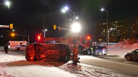 Mississauga-fire-department-helping-crashed-car-in-winter-street-of-Canada
