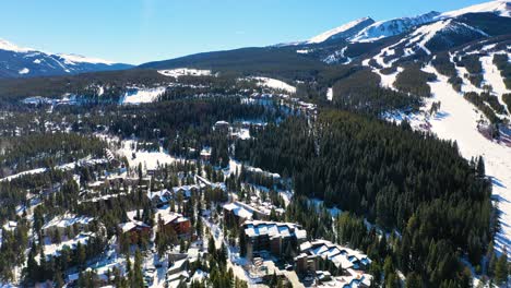 Rocky-Mountain-Town-with-Houses-and-Ski-Slopes-in-the-Cold-Winter-Snow