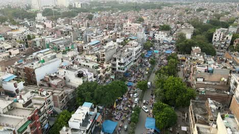 4K-Aerial-Shots-of-Local-Market-in-New-Delhi-Residential-Suburbs-on-a-beautiful-day-gliding-over-Rooftops,-streets,-parks-and-markets-in-India