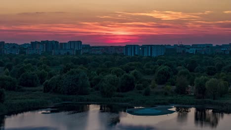 Aerial-View-Timelapse-Over-Vacaresti-Delta-At-Sunset,-Orange,-Yellow,-Bucharest,-Romania