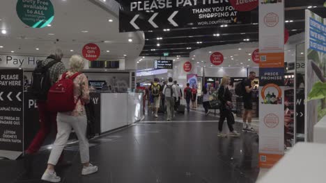People-walking-through-duty-free-sales-area-of-London-Stansted-Airport