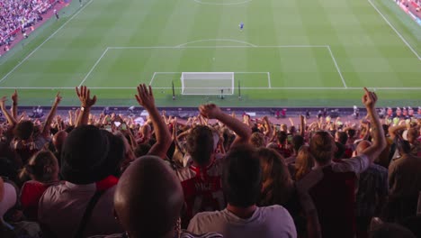Soccer-team-supporters-cheer-and-salute-their-favourite-club-inside-stadium