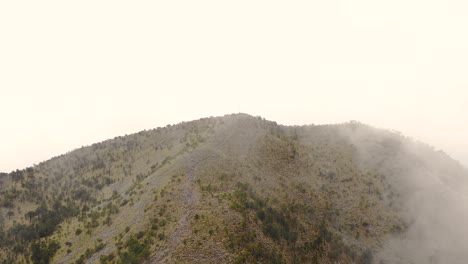 Aerial-Drone-View-of-El-Ajusco-Hillside-Shrouded-in-Low-Mist-in-Mexico