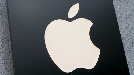 American-multinational-technology-company-Apple-and-its-logo-seen-displayed-outside-the-store