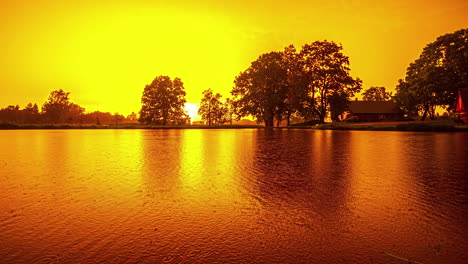 Rainy-Day-With-Colorful-Sky-Reflected-Over-Tranquil-Lake-During-Dusk-Until-Dawn