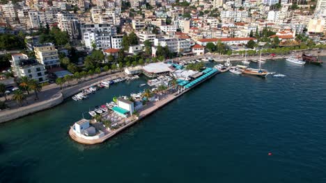 Saranda-Harbor-with-Anchored-Boats,-Picturesque-Pier,-and-Bay-Views---A-Must-Visit-Summer-Vacation-Destination-for-Travelers