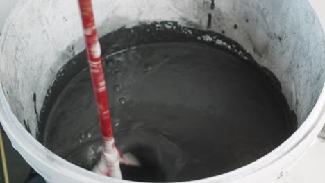 black-wall-paint-mixing-paint-bucket