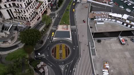 Aerial-View-Of-Traffic-Over-Francisco-Sá-Carneiro-Roundabout-Near-Marina-do-Funchal-In-Portugal