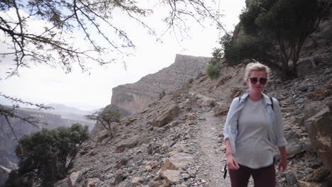 Woman-hiking-through-the-Wadi-Mountains-of-Oman