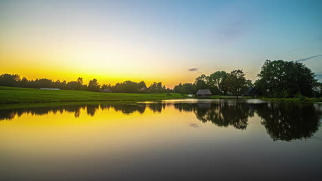 Vibrant-Golden-Sunlight-During-Sunset-Reflected-Over-Serene-Lake