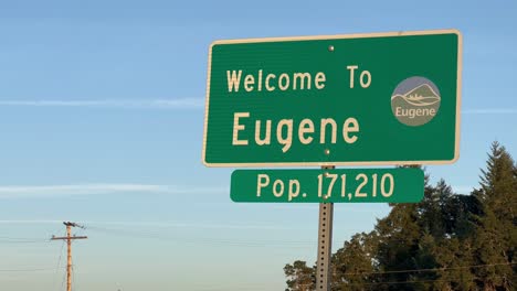 Fixed-shot-of-the-Welcome-signpost-of-Eugene,-Oregon,-with-the-population
