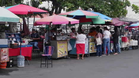 Food-carts-on-street-in-front-of-Santa-Ana-Cathedral,-El-Salvador