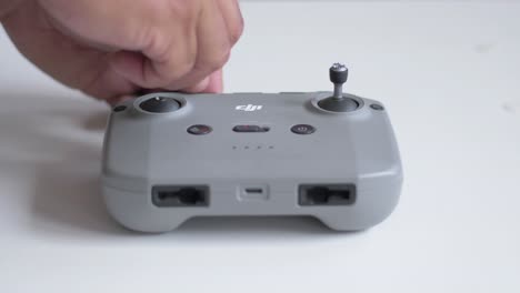 Demonstration-of-the-steps-to-place-levers-on-the-DJI-controller-joysticks