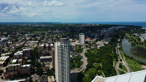 Aerial-view-over-tall-buildings-in-Milwaukee,-sunny,-summer-day-in-USA