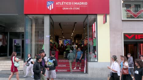 Shoppers-and-club-fans-are-seen-at-the-Spanish-professional-football-club-team-Atletico-de-Madrid,-commonly-known-as-Atleti,-the-official-brand-store-in-Madrid,-Spain