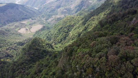 Flyover-heavily-forested-steep-mountain-slopes-in-El-Salvador-jungle